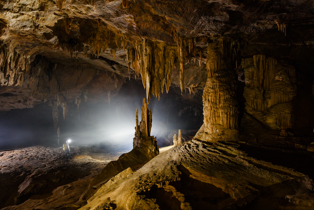 A cave explorer inside Nuoc Nit, Phong Nha Ke Bang, Vietnam